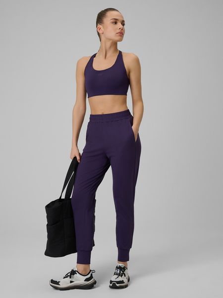 4F Spodnie treningowe szybkoschnące damskie - fioletowe XL. Fioletowe spodnie sportowe damskie 4f, xl, na fitness i siłownię. Za 179.99 zł.