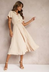 Beżowa Plisowana Rozkloszowana Sukienka z Paskiem Guzikami i Gumką w Talii Nelaika. Brązowe sukienki damskie Renee, na co dzień, l, bez wzorów, eleganckie, bez kołnierzyka, bez ramiączek, midi, kopertowe. W wyprzedaży za 97.99 zł.