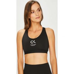 Calvin Klein Performance - Biustonosz. Białe biustonosze Calvin Klein Performance, bez wzorów, z elastanu. W wyprzedaży za 139.90 zł.