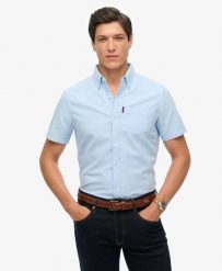 Superdry Oxford Short Sleeve Shirt – koszula Oxford krótki rękaw 100% bawełna. Niebieskie koszule damskie Superdry., s, bez wzorów, z bawełny, casualowe, bez kołnierzyka, bez ramiączek. Za 279.65 zł.