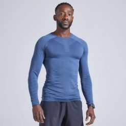 Koszulka do biegania z długim rękawem męska Kiprun Skincare. Niebieskie t-shirty sportowe męskie KIPRUN, m, z elastanu, bez ramiączek, do biegania. Za 99.99 zł.