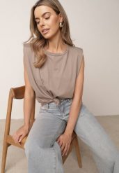 Beżowy Bawełniany Top Oversize Bez Rękawów z Wiązaniem i Poduszkami w Ramionach Apixie. Brązowe topy damskie Born2be, bez wzorów, z bawełny, bez kołnierzyka. Za 69.99 zł.