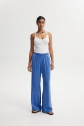 SPODNIE LEXI NIEBIESKIE XL - Flawless. Niebieskie spodnie materiałowe damskie Flawless, bez wzorów, z materiału, eleganckie, z podwyższonym stanem. Za 449.00 zł.