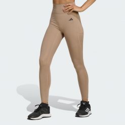 Legginsy 7/8 bez szwu z przodu Optime Essentials. Brązowe legginsy sportowe damskie Adidas, xl, bez wzorów, na fitness i siłownię, climacool (adidas). W wyprzedaży za 142.35 zł.