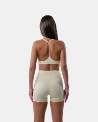 Damski stanik sportowy z plecami Y na jogę i pilates – Encore – Butter. Żółte biustonosze sportowe damskie AESTHETICWOLF, bez wzorów, z dzianiny. Za 179.99 zł.