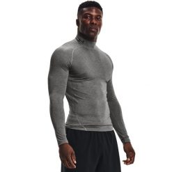 Koszulka z długim rękawem i stójką Under Armour HeatGear®. Czarne t-shirty sportowe męskie Under Armour, xs, z materiału, bez ramiączek, na fitness i siłownię. Za 152.54 zł.