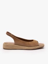 Jasnobrązowe wsuwane sandały. Brązowe sandały damskie Brawo sp. z o.o., bez wzorów, ze skóry, bez obcasa, na koturnie. Za 399.99 zł.