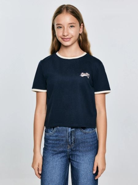 Koszulka dziewczęca z kontrastowym wykoŅczeniem granatowa Kola 403. Niebieskie koszulki dziewczęce Big Star, bez wzorów, z bawełny, bez ramiączek. W wyprzedaży za 39.99 zł.