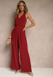 Bordowy Kombinezon o Taliowanym Kroju z Dekoltem Halter i Wiązanym Paskiem Malisena. Czerwone kombinezony damskie Renee, l, bez wzorów, eleganckie, bez kołnierzyka, bez ramiączek. Za 99.99 zł.