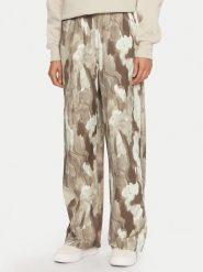 Champion Spodnie dresowe 117502 Beżowy Loose Fit. Brązowe spodnie dresowe damskie CHAMPION, s, bez wzorów, z dresówki. Za 239.99 zł.
