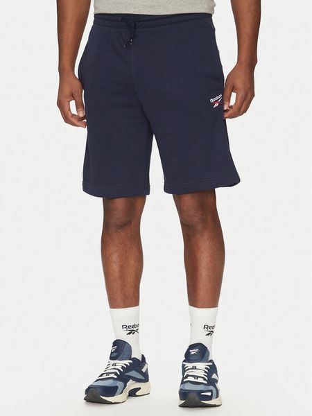 Reebok Szorty sportowe 100217147 Granatowy Regular Fit. Niebieskie szorty męskie Reebok, bez wzorów, z syntetyku, sportowe. Za 119.99 zł.
