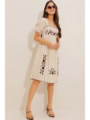 Defile Sukienka w kolorze beżowym rozmiar: L. Brązowe sukienki damskie Defile, l, bez wzorów, bez kołnierzyka, bez ramiączek, midi, rozkloszowane. Za 66.00 zł.