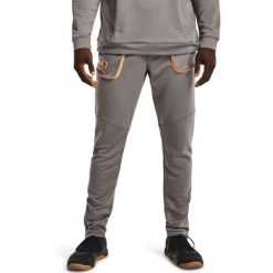 Spodnie Under Armour Terry Evolution, Mężczyźni. Brązowe spodnie materiałowe męskie Under Armour, bez wzorów, z poliesteru. Za 390.00 zł.