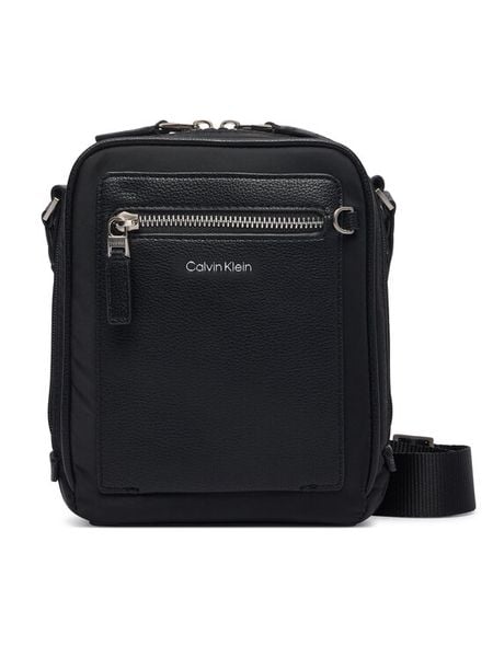 Calvin Klein Saszetka Ssnl Raised Logo Reporter LV04D3500G Czarny. Czarne saszetki męskie CALVIN KLEIN, ze skóry. Za 329.99 zł.