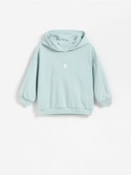Bawełniana bluza z kapturem - jasnozielony. Zielone bluzy i bluzki niemowlęce Reserved, bez wzorów, z bawełny, bez ramiączek, z kapturem. Za 49.99 zł.