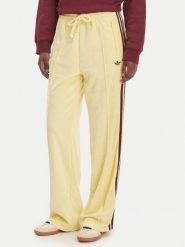 Adidas Spodnie dresowe Terry Towel Firebird KQ6662 Żółty Loose Fit. Żółte spodnie dresowe damskie Adidas, l, bez wzorów, z bawełny. Za 348.99 zł.