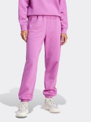 Adidas Spodnie dresowe w kolorze fioletowym rozmiar: L. Różowe spodnie dresowe damskie Adidas, l, bez wzorów, z dresówki. Za 131.74 zł.