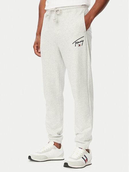 Tommy Jeans Spodnie dresowe DM0DM23593 Szary jasny Regular Fit. Szare spodnie dresowe męskie Tommy Jeans, bez wzorów, z bawełny. Za 289.99 zł.
