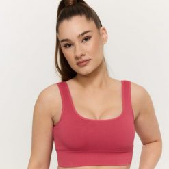 Biustonosz damski bezszwowy bez zapięcia Bloom. Czerwone biustonosze sportowe damskie GYMBEAM, bez wzorów, z elastanu. Za 110.90 zł.