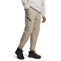 Spodnie treningowe Under Armour Unstoppable Joggers 1388823. Brązowe spodnie sportowe męskie Under Armour, z elastanu. Za 303.95 zł.