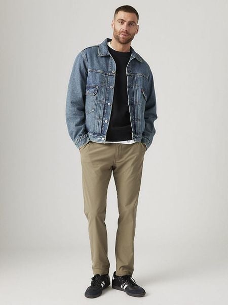 Levi's Spodnie chino w kolorze beżowym rozmiar: W34/L30. Brązowe spodnie materiałowe męskie Levi's, bez wzorów. Za 214.95 zł.