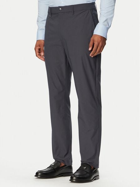 Calvin Klein Spodnie materiałowe LV04LB610G Granatowy Slim Fit. Niebieskie spodnie materiałowe męskie CALVIN KLEIN, bez wzorów, z materiału. Za 409.99 zł.