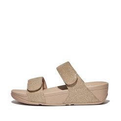 Kobiece klapki na koturnie FitFlop Lulu Adjustable. Brązowe klapki damskie FIT FLOP, bez wzorów, z materiału, bez obcasa, na koturnie. Za 473.00 zł.