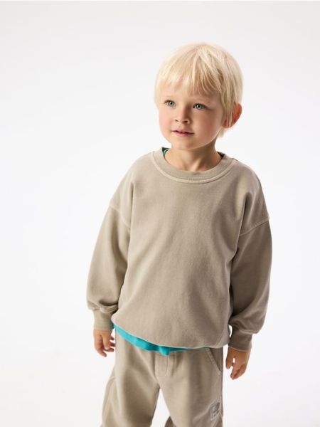 Bawełniana bluza - beżowy. Brązowe bluzy i bluzki niemowlęce Reserved, bez wzorów, z bawełny, bez ramiączek, bez kaptura. Za 49.99 zł.
