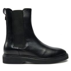 Sztyblety Calvin Klein. Czarne botki damskie CALVIN KLEIN, bez obcasa, na płaskiej podeszwie, bez zapięcia. Za 809.99 zł.