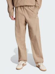 Adidas Spodnie "Originals" w kolorze beżowym rozmiar: L. Brązowe spodnie materiałowe męskie Adidas, bez wzorów, z materiału. Za 179.95 zł.