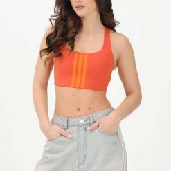 Biustonosz dla kobiet adidas Workout 3-Stripes. Brązowe biustonosze Adidas, bez wzorów, z materiału. Za 207.65 zł.