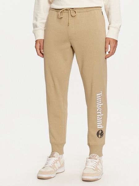 Timberland Spodnie dresowe TB0A5YFBDH41 Beżowy Regular Fit. Brązowe spodnie dresowe męskie Timberland, bez wzorów, z bawełny. Za 209.99 zł.