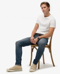 Superdry Jeansy Slim Vintage z Bawełny Organicznej – Storm Blue. Niebieskie jeansy męskie Superdry. Za 478.55 zł.