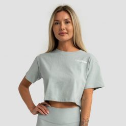 Koszulka damska fitness krótka luźna eukaliptusowa Limitless. Zielone bluzki sportowe damskie GYMBEAM, s, bez wzorów, z bawełny, bez ramiączek. Za 76.90 zł.