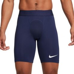 Męskie Spodenki Kompresyjne Pro Strike DriFIT. Białe szorty męskie Nike, z elastanu, bez kołnierzyka. Za 126.55 zł.