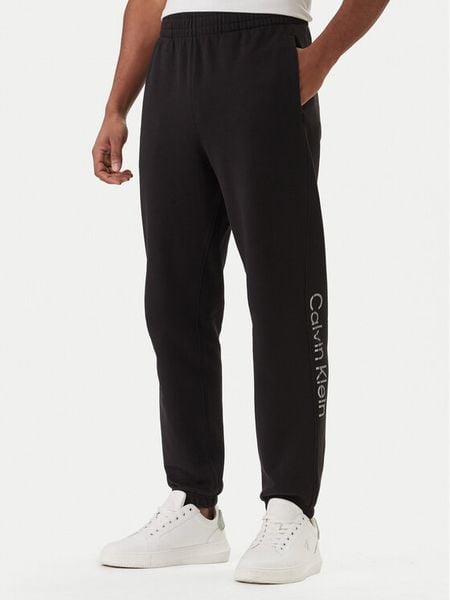 Calvin Klein Spodnie dresowe Eu Sportswear Graphic LV04LF236G Czarny Regular Fit. Czarne spodnie dresowe męskie CALVIN KLEIN, bez wzorów, z bawełny. Za 369.99 zł.