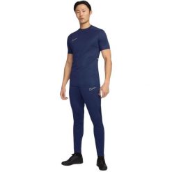 Męskie Spodnie Do Biegania Academy 25 DriFIT. Czarne spodnie materiałowe męskie Nike, bez wzorów, z dzianiny. Za 179.99 zł.