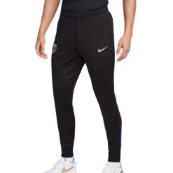 Spodnie piłkarskie Nike Dri-FIT Slim Fit Męskie Czarno-Czerwone. Białe spodnie materiałowe męskie Nike, bez wzorów, z elastanu. Za 328.50 zł.