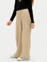 Calvin Klein Jeans Spodnie dresowe IG0IG02875 D Beżowy Wide Leg. Brązowe spodnie dziewczęce Calvin Klein Jeans, z bawełny. Za 259.99 zł.