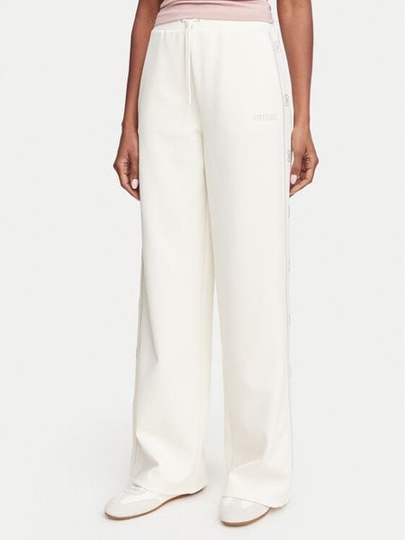 Guess Spodnie dresowe V5BB12 KCX22 Kremowy Regular Fit. Białe spodnie dresowe damskie Guess, xs, z aplikacjami, z dresówki. Za 474.99 zł.