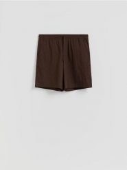 Szorty loose fit - ciemnobrązowy. Brązowe szorty męskie Reserved, z tkaniny, bez kołnierzyka. Za 119.99 zł.