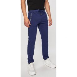 Versace Jeans - Spodnie. Niebieskie spodnie materiałowe męskie Versace Jeans, bez wzorów, z bawełny, casualowe. W wyprzedaży za 319.90 zł.