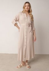 Beżowa Bawełniana Sukienka Koszulowa z Paskiem i Regulowanymi Rękawami Sadevia. Brązowe sukienki damskie Born2be, do pracy, l, bez wzorów, z bawełny, biznesowe, bez kołnierzyka, bez ramiączek, maxi, koszulowe. Za 119.99 zł.