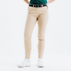 Spodnie do golfa chino damskie Inesis MW500 bawełniane. Niebieskie spodnie materiałowe damskie INESIS, bez wzorów, z bawełny, eleganckie. Za 99.99 zł.