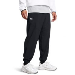 Under Armour VIBE WOVEN JOGGER Spodnie męskie. Czarne spodnie sportowe męskie Under Armour, z materiału. Za 209.99 zł.