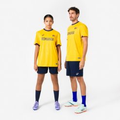 Koszulka piłkarska dla kibiców Rumunia 2026. Niebieskie t-shirty damskie KIPSTA, l, z materiału, bez ramiączek, do piłki nożnej. Za 44.99 zł.
