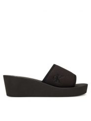 Calvin Klein Jeans Klapki Beach Wedge Slide Canvas YW0YW01725 Czarny. Czarne klapki damskie Calvin Klein Jeans, bez wzorów, z jeansu, bez obcasa. Za 199.99 zł.
