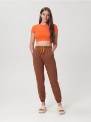 Spodnie dresowe jogger - brązowy. Brązowe spodnie sportowe damskie Sinsay, l, z bawełny. W wyprzedaży za 39.99 zł.