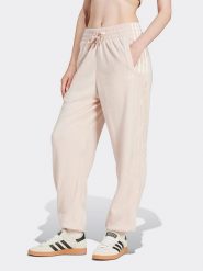 Adidas Spodnie dresowe w kolorze jasnoróżowym rozmiar: XL. Różowe spodnie dresowe damskie Adidas, xl, bez wzorów, z dresówki. Za 158.10 zł.