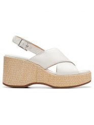 Clarks Skórzane sandały "Manon Wish" w kolorze białym na koturnie rozmiar: 42. Białe sandały damskie Clarks, bez wzorów, bez obcasa, na koturnie. Za 202.03 zł.